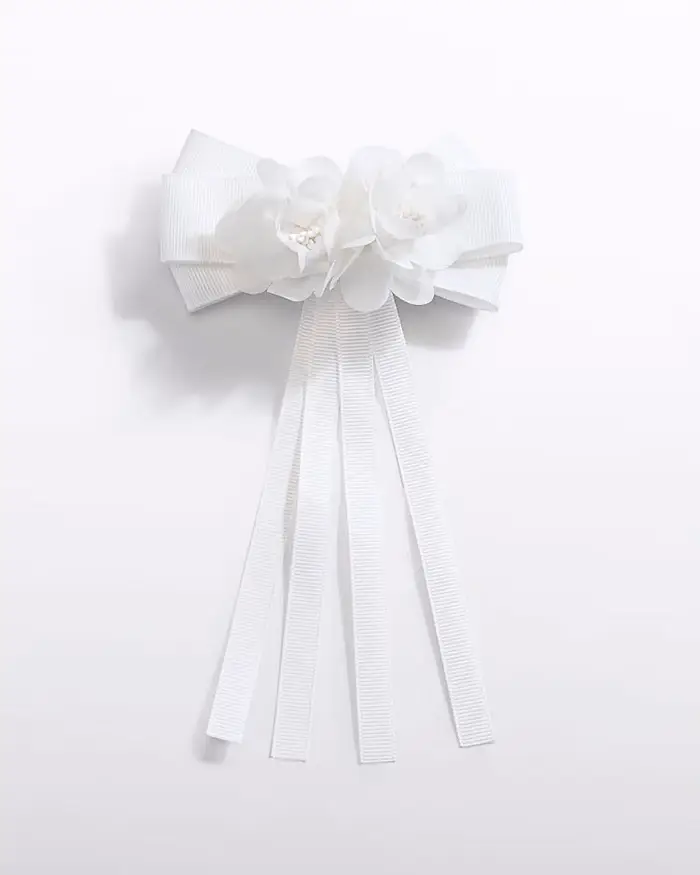 Molletta Abel & Lula con fiocco e fiore bianco applicato