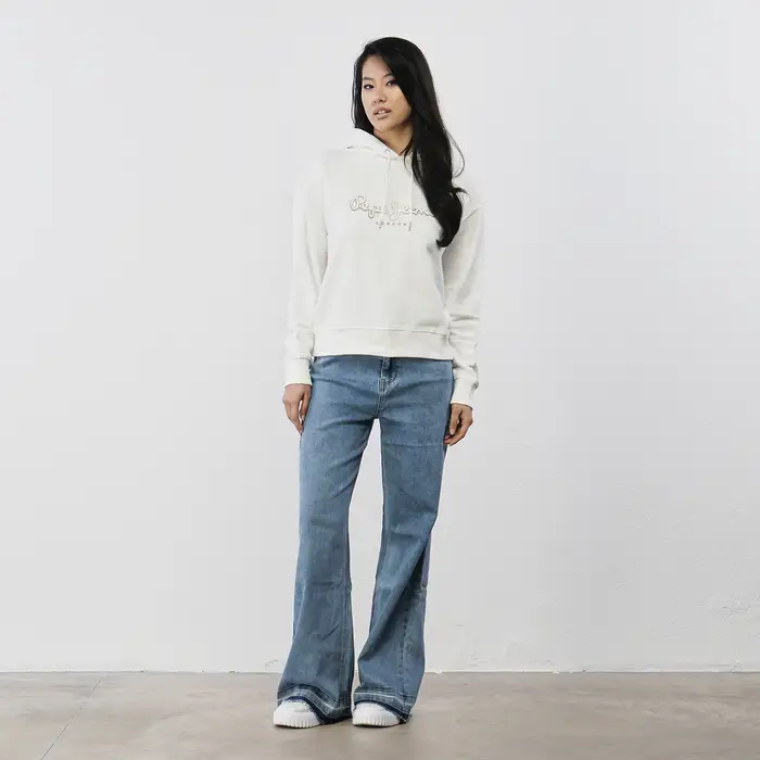 Jeans azzurri a zampa da donna con orlo sfrangiato