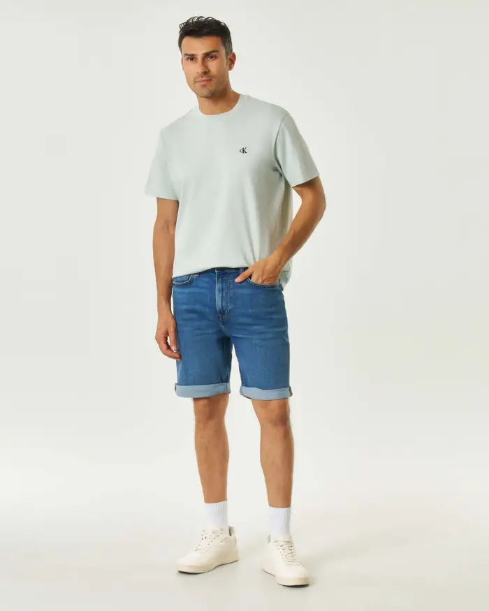 Calvin Klein Jeans Bermuda lavaggio medio stone washed in cotone stretch con risvolto