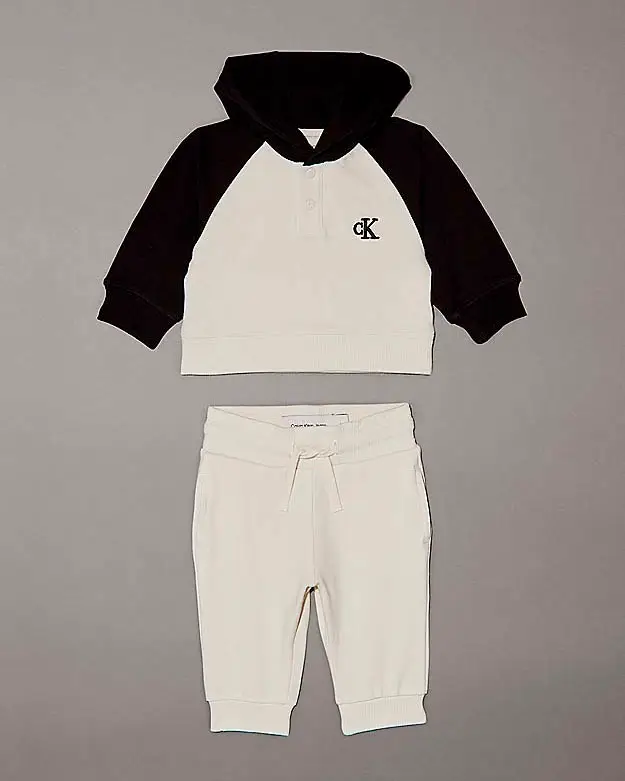 Tuta bicolore panna e nera in cotone stretch