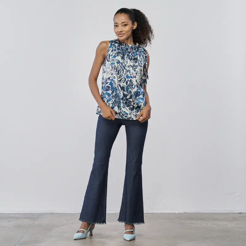 LOKITA Pantaloni lunghi blu a zampa da donna in tessuto denim con orlo sfrangiato