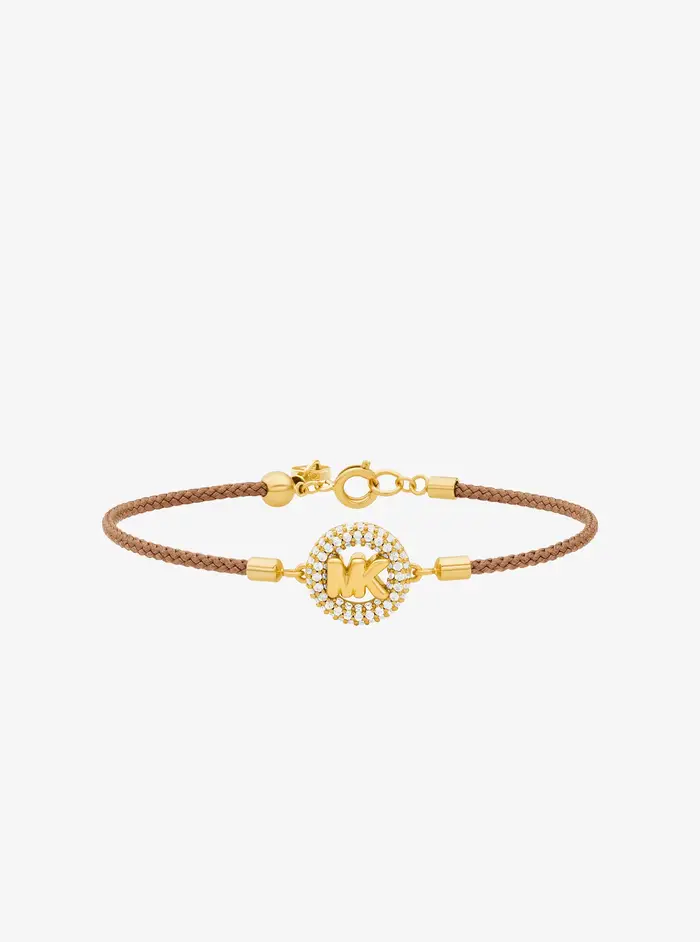 Michael Kors MK Bracciale in cordoncino tonalità oro con logo e pavé - Marrone