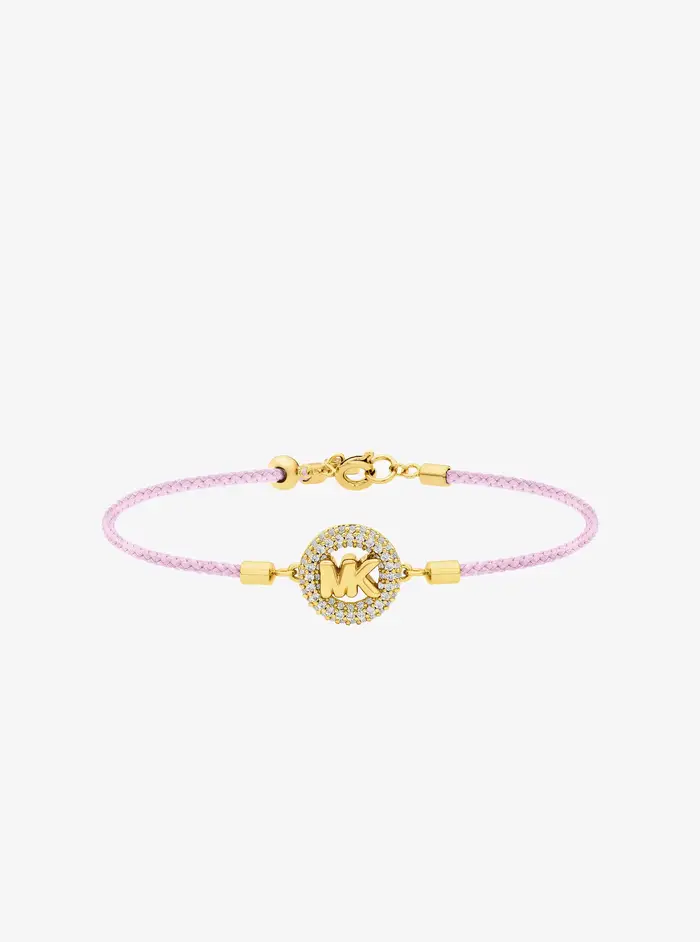 Michael Kors MK Bracciale in cordoncino tonalità oro con logo e pavé - Rosa