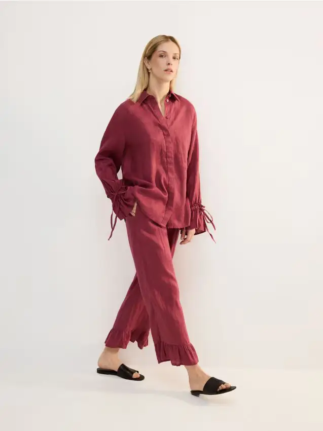 Reserved Pantaloni in lino con volant - rosa cipria