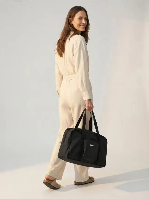 Sinsay Grande borsa da viaggio che si piega in una pochette - nero