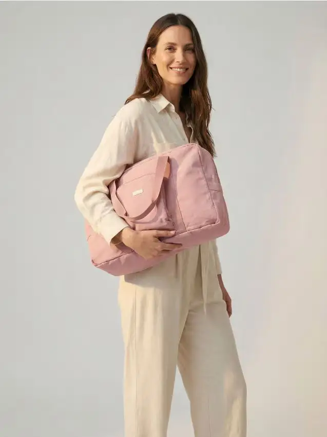 Sinsay Grande borsa da viaggio che si piega in una pochette - rosa cipria