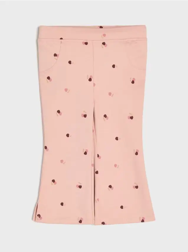 Pantaloni flare in cotone con motivo di ciliegie - rosa cipria