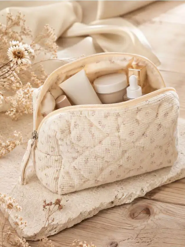 Pochette per cosmetici con motivo floreale - panna