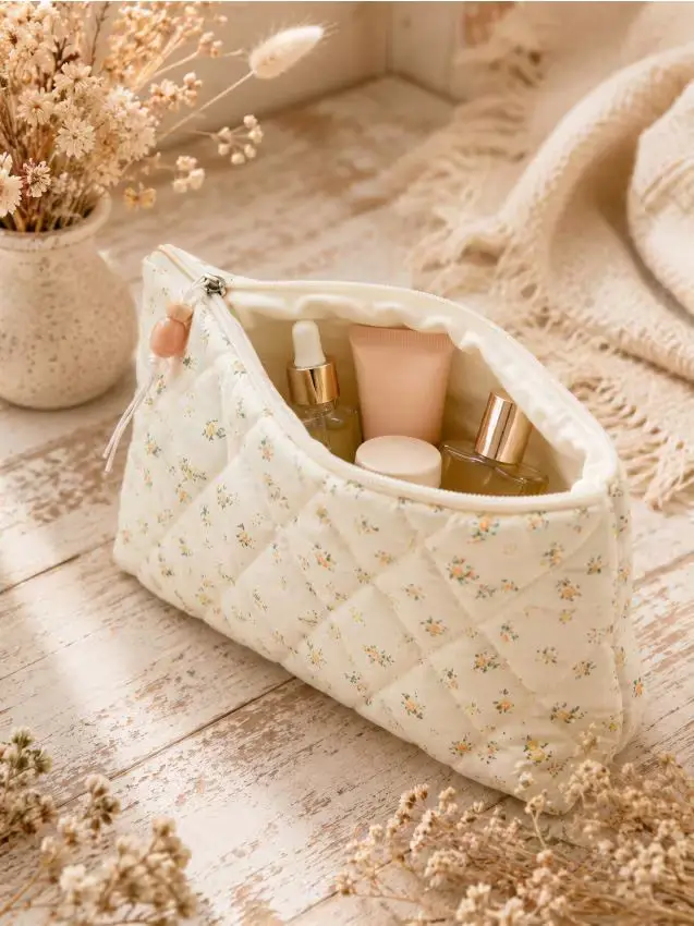 Pochette per cosmetici con motivo floreale - panna